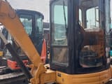 2024 Caterpillar 303.5 mini excavator, side profile view