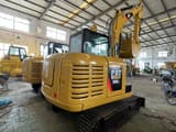 2023 Caterpillar 306E2 mini excavator rear three-quarter view