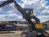 2018 Volvo EW240EMH material handler side view