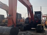 2025 Hitachi ZX210 crawler excavator, front three-quarter view
