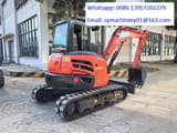 2023 Kubota KX057-4 mini excavator, rear three-quarter view