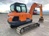 2021 Doosan DX60C mini excavator, rear three-quarter view