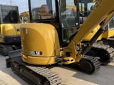 Caterpillar 303.5E mini excavator, rear three-quarter view
