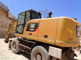 2016 Caterpillar M320F wheel excavator, rear three-quarter view