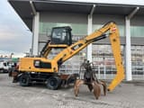2018 Caterpillar MH3024 material handler side view