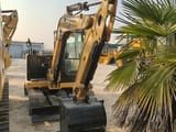 2026 Caterpillar 305.5E2 mini excavator, front three-quarter view