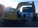 2021 Caterpillar 310-07 crawler excavator, side view