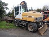 2011 Liebherr A314 wheel excavator, rear three-quarter view
