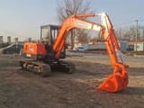 2023 Doosan DH55 mini excavator, three-quarter view
