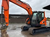 2022 Doosan DX140 crawler excavator, side profile view