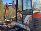 1999 Kubota KX91-2 mini excavator, side view of cab and boom