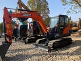 2023 Doosan DX60 mini excavator, side view
