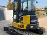 2022 Komatsu PC-55MR mini excavator, front three-quarter view