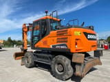 2021 Doosan DX160W wheel excavator, rear three-quarter view