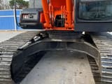 2024 Hitachi ZX200 crawler excavator, front view of undercarriage and cab