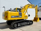 2025 Komatsu PC210-10M0 crawler excavator, rear three-quarter view