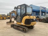 2000 Caterpillar 302.5 mini excavator, rear three-quarter view
