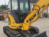 2024 Komatsu PC35 MR mini excavator, front three-quarter view
