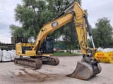 2018 Caterpillar 323GC crawler excavator, side view