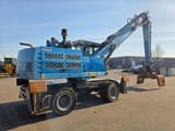 2016 Fuchs MHL331 material handler, rear three-quarter view