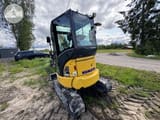 2022 Komatsu PC26 MR mini excavator, front three-quarter view