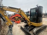 2024 Caterpillar 303.5ECR mini excavator, front three-quarter view