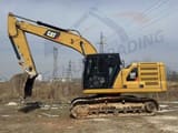 Caterpillar 320GC rupsgraafmachine uit 2018, zijaanzicht