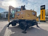 2021 Caterpillar MH3022-06C material handler, rear three-quarter view