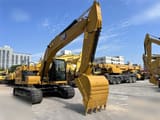 2023 Caterpillar 323 crawler excavator, front three-quarter view