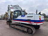 2013 Volvo EC220DL crawler excavator, rear three-quarter view