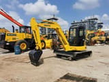 2020 Komatsu 55MR mini excavator, front three-quarter view