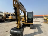 2023 Caterpillar 305.5E2 mini excavator, front view