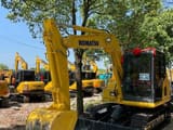 2024 Komatsu PC70-8 mini excavator, front three-quarter view