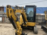 2023 Caterpillar 303.5ECR mini excavator, front three-quarter view
