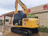 2023 Caterpillar 313D2 GC crawler excavator, rear three-quarter view