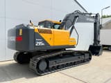 2025 Hyundai R215 SMART PLUS crawler excavator, rear three-quarter view