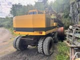 1994 Caterpillar 212B wheel excavator, rear three-quarter view