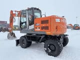 2010 Hitachi Zaxis 140W wheel excavator, side view