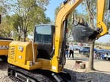 2025 Caterpillar 306 mini excavator, rear three-quarter view
