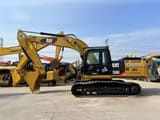 2012 Caterpillar 325DL crawler excavator side view