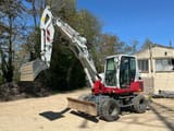 2018 Takeuchi TB295W wheel excavator, front three-quarter view