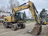 2010 Caterpillar M318D wheel excavator, side profile view