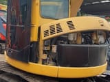 2023 Caterpillar 308C mini excavator, side view with open engine compartment