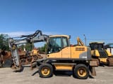 2011 Volvo EW140C wheel excavator, side view