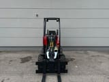2023 Oehler A6026 mini excavator, front view with pallet forks