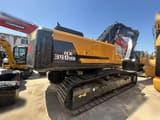 2024 Hyundai HX340HD crawler excavator, rear three-quarter view