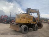 2022 Caterpillar M319-07B wheel excavator, rear three-quarter view