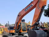 2025 Develon DX225 LC-10 crawler excavator, side profile view