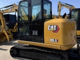 2023 Caterpillar 305.5 mini excavator, rear three-quarter view