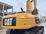 2023 Caterpillar 330D2 excavator, rear three-quarter view